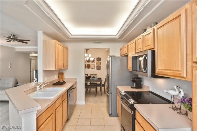 Step into this inviting and pristine first floor waterfront home on Colonial Country Club in Florida - for sale on GolfHomes.com, golf home, golf lot