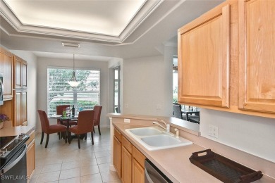 Step into this inviting and pristine first floor waterfront home on Colonial Country Club in Florida - for sale on GolfHomes.com, golf home, golf lot