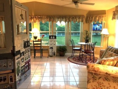 his stunning 2-bedroom, 2-bathroom home with a den offers 2,100 on Sun n Lake Golf and Country Club in Florida - for sale on GolfHomes.com, golf home, golf lot