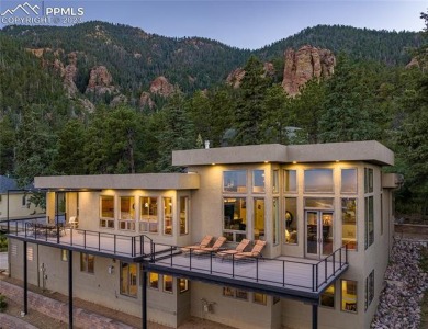 Set on the hillside in a peaceful and secluded location behind on Broadmoor Golf Club in Colorado - for sale on GolfHomes.com, golf home, golf lot