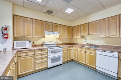 Sky-high living in this top floor condo with 2 spacious bedrooms on Leisure World Golf Club in Maryland - for sale on GolfHomes.com, golf home, golf lot