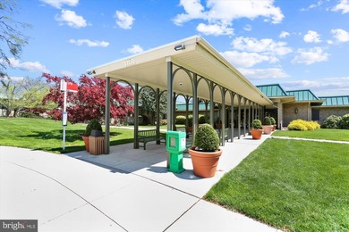 Sky-high living in this top floor condo with 2 spacious bedrooms on Leisure World Golf Club in Maryland - for sale on GolfHomes.com, golf home, golf lot