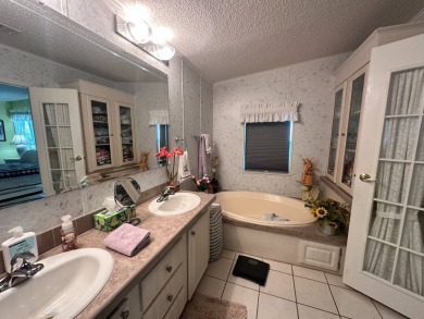 FULLY FURNISHED RETREAT ON 9th FAIRWAY! 2000 Homes of Merit  Lot on Four Lakes Golf Club in Florida - for sale on GolfHomes.com, golf home, golf lot