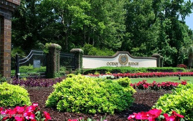 Beautiful Leopard's Chase golf course and pond homesite on Ocean Ridge Plantation in North Carolina - for sale on GolfHomes.com, golf home, golf lot