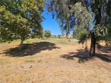 It's the well manicured looking home on a large lot backing the on Hemet Golf Club in California - for sale on GolfHomes.com, golf home, golf lot