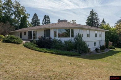 Welcome to this stunning timeless midcentury style home on Shoreland Golf and Tennis Club in Minnesota - for sale on GolfHomes.com, golf home, golf lot