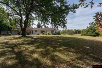 Welcome to this stunning timeless midcentury style home on Shoreland Golf and Tennis Club in Minnesota - for sale on GolfHomes.com, golf home, golf lot