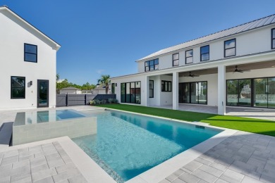 A stunning fusion of modern elegance and sophistication, nestled on Camp Creek Golf Course in Florida - for sale on GolfHomes.com, golf home, golf lot