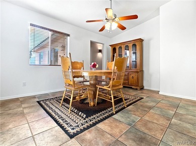 Welcome to a beautifully designed 4-bedroom, 3.5-bath home on Los Lagos Golf Club in Arizona - for sale on GolfHomes.com, golf home, golf lot