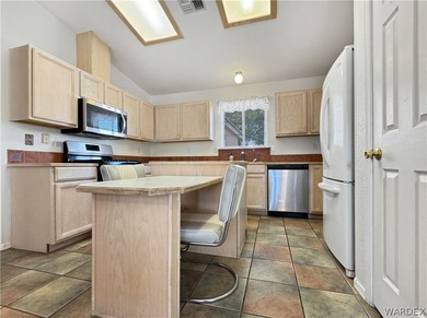 Welcome to a beautifully designed 4-bedroom, 3.5-bath home on Los Lagos Golf Club in Arizona - for sale on GolfHomes.com, golf home, golf lot