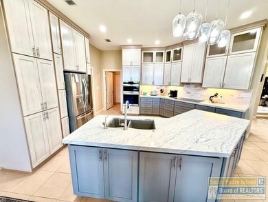 Stunning 3-bedroom 3.5-bathroom lakefront home offers the on South Padre Island Golf Club in Texas - for sale on GolfHomes.com, golf home, golf lot