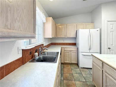 Welcome to a beautifully designed 4-bedroom, 3.5-bath home on Los Lagos Golf Club in Arizona - for sale on GolfHomes.com, golf home, golf lot