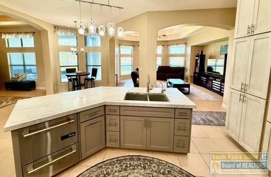 Stunning 3-bedroom 3.5-bathroom lakefront home offers the on South Padre Island Golf Club in Texas - for sale on GolfHomes.com, golf home, golf lot