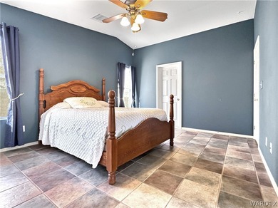 Welcome to a beautifully designed 4-bedroom, 3.5-bath home on Los Lagos Golf Club in Arizona - for sale on GolfHomes.com, golf home, golf lot