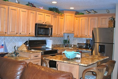 Completely refurbished top floor ocean view 1/1 at Villas III on Ocean Village Golf Course in Florida - for sale on GolfHomes.com, golf home, golf lot