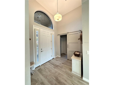 Welcome to Sawgrass Drive, a better-than-new home in the highly on Lake Ashton Golf Club in Florida - for sale on GolfHomes.com, golf home, golf lot