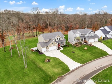 This Oak Harbor Preserve home is a treasure! Boasting 4 bedrooms on The Golf Club At Thornapple Pointe in Michigan - for sale on GolfHomes.com, golf home, golf lot