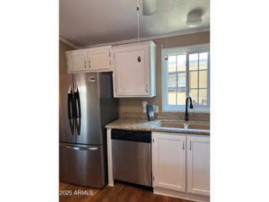 This charming 2-bedroom, 2-bath home is located in the highly on Paradise Peak Golf Course in Arizona - for sale on GolfHomes.com, golf home, golf lot