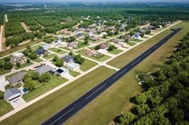 FLY IN  SEE THIS READY TO BUILD LOT BEFORE IT'S GONE! Here's on Pecan Plantation Country Club in Texas - for sale on GolfHomes.com, golf home, golf lot