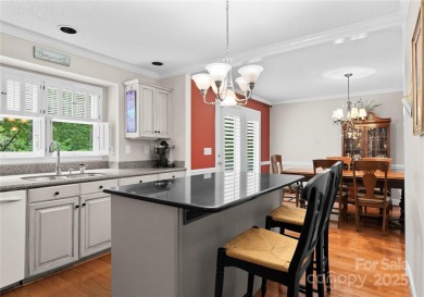 Nestled on a quiet cul-de-sac  backing up to the scenic Raintree on Raintree Country Club in North Carolina - for sale on GolfHomes.com, golf home, golf lot