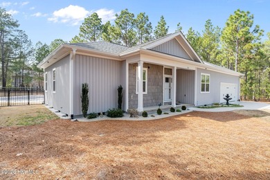 Enjoy the best of lake and golf community living in this on Seven Lakes Country Club in North Carolina - for sale on GolfHomes.com, golf home, golf lot