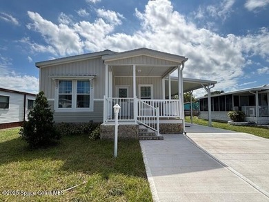 Experience modern Florida living in this stunning new on Barefoot Bay Golf Course in Florida - for sale on GolfHomes.com, golf home, golf lot