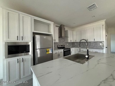 Experience modern Florida living in this stunning new on Barefoot Bay Golf Course in Florida - for sale on GolfHomes.com, golf home, golf lot