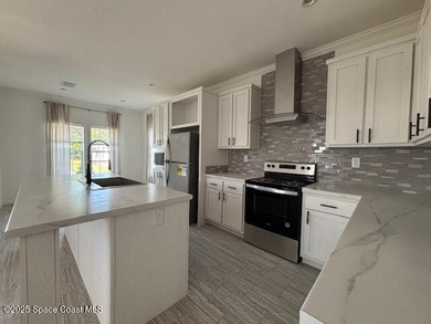 Experience modern Florida living in this stunning new on Barefoot Bay Golf Course in Florida - for sale on GolfHomes.com, golf home, golf lot