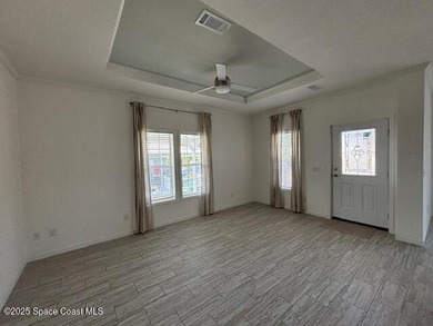 Experience modern Florida living in this stunning new on Barefoot Bay Golf Course in Florida - for sale on GolfHomes.com, golf home, golf lot