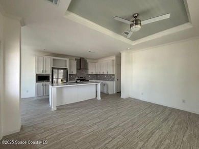 Experience modern Florida living in this stunning new on Barefoot Bay Golf Course in Florida - for sale on GolfHomes.com, golf home, golf lot