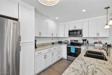 This impeccably remodeled two-bedroom, two bath residence offers on Beachview Golf Club in Florida - for sale on GolfHomes.com, golf home, golf lot