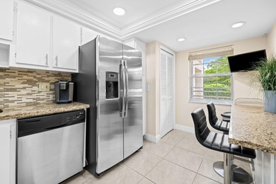 Discover your slice of paradise in this beautiful 2BR/2BA Palm on Palm-Aire Country Club and Resort - Palms in Florida - for sale on GolfHomes.com, golf home, golf lot