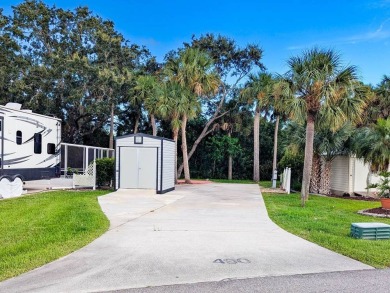Check out this immaculate 40'x80' RV lot backing up to nature! on The Great Outdoors Golf and Country Club in Florida - for sale on GolfHomes.com, golf home, golf lot