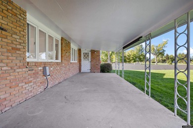 Custom built all-brick ranch home located on the Paradise Valley on Paradise Valley Country Club in Wyoming - for sale on GolfHomes.com, golf home, golf lot