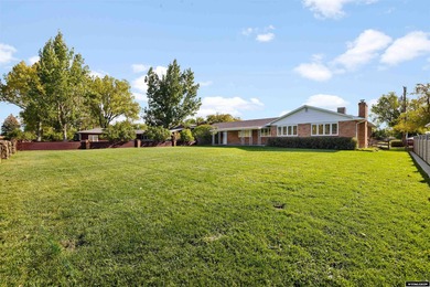 Custom built all-brick ranch home located on the Paradise Valley on Paradise Valley Country Club in Wyoming - for sale on GolfHomes.com, golf home, golf lot