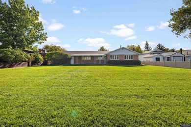 Custom built all-brick ranch home located on the Paradise Valley on Paradise Valley Country Club in Wyoming - for sale on GolfHomes.com, golf home, golf lot