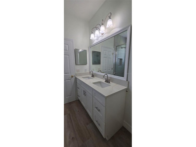 Exceptional residence in the prestigious gated community of on Eagle Creek Golf Club in Florida - for sale on GolfHomes.com, golf home, golf lot