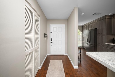 Enjoy sipping your morning coffee from the lanai of this on Royal Palm Golf Club in Florida - for sale on GolfHomes.com, golf home, golf lot