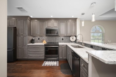 Enjoy sipping your morning coffee from the lanai of this on Royal Palm Golf Club in Florida - for sale on GolfHomes.com, golf home, golf lot