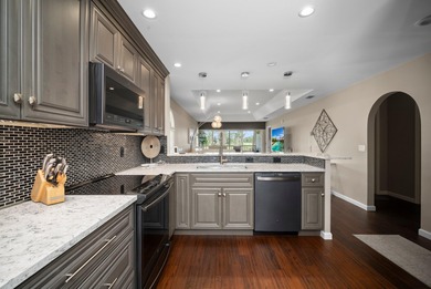 Enjoy sipping your morning coffee from the lanai of this on Royal Palm Golf Club in Florida - for sale on GolfHomes.com, golf home, golf lot