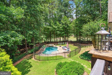 Welcome to a rare blend of luxury, comfort, and natural on Towne Lake Hills Golf Club in Georgia - for sale on GolfHomes.com, golf home, golf lot