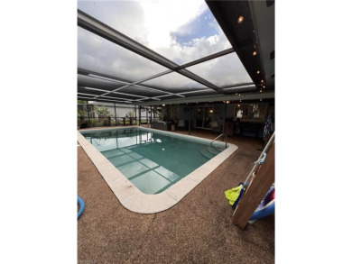 Welcome to your dream home at 6765 Overlook Drive, nestled in on Cypress Lake Country Club in Florida - for sale on GolfHomes.com, golf home, golf lot