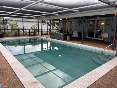 Welcome to your dream home at 6765 Overlook Drive, nestled in on Cypress Lake Country Club in Florida - for sale on GolfHomes.com, golf home, golf lot