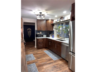 Welcome to your dream home at 6765 Overlook Drive, nestled in on Cypress Lake Country Club in Florida - for sale on GolfHomes.com, golf home, golf lot