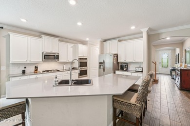 Luxury Living in Palencia, Pond-front Perfection! Welcome to on The Palencia Club in Florida - for sale on GolfHomes.com, golf home, golf lot