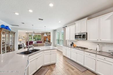 Luxury Living in Palencia, Pond-front Perfection! Welcome to on The Palencia Club in Florida - for sale on GolfHomes.com, golf home, golf lot