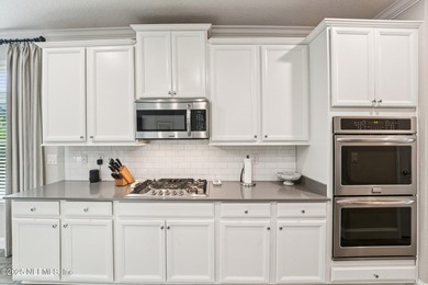 Luxury Living in Palencia, Pond-front Perfection! Welcome to on The Palencia Club in Florida - for sale on GolfHomes.com, golf home, golf lot