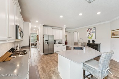 Luxury Living in Palencia, Pond-front Perfection! Welcome to on The Palencia Club in Florida - for sale on GolfHomes.com, golf home, golf lot