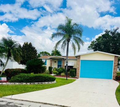 Experience the perfect coastal feel in this beautiful on Pine Lakes Country Club in Florida - for sale on GolfHomes.com, golf home, golf lot