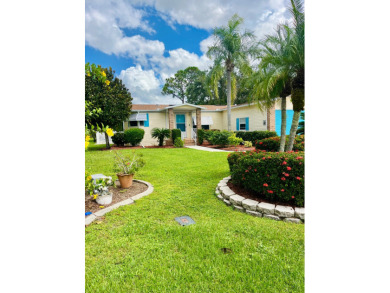 Experience the perfect coastal feel in this beautiful on Pine Lakes Country Club in Florida - for sale on GolfHomes.com, golf home, golf lot